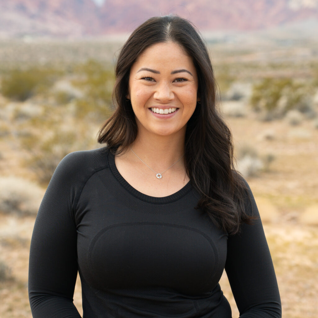 Deedee Oguma smiling at the camera at Red Rock National Park